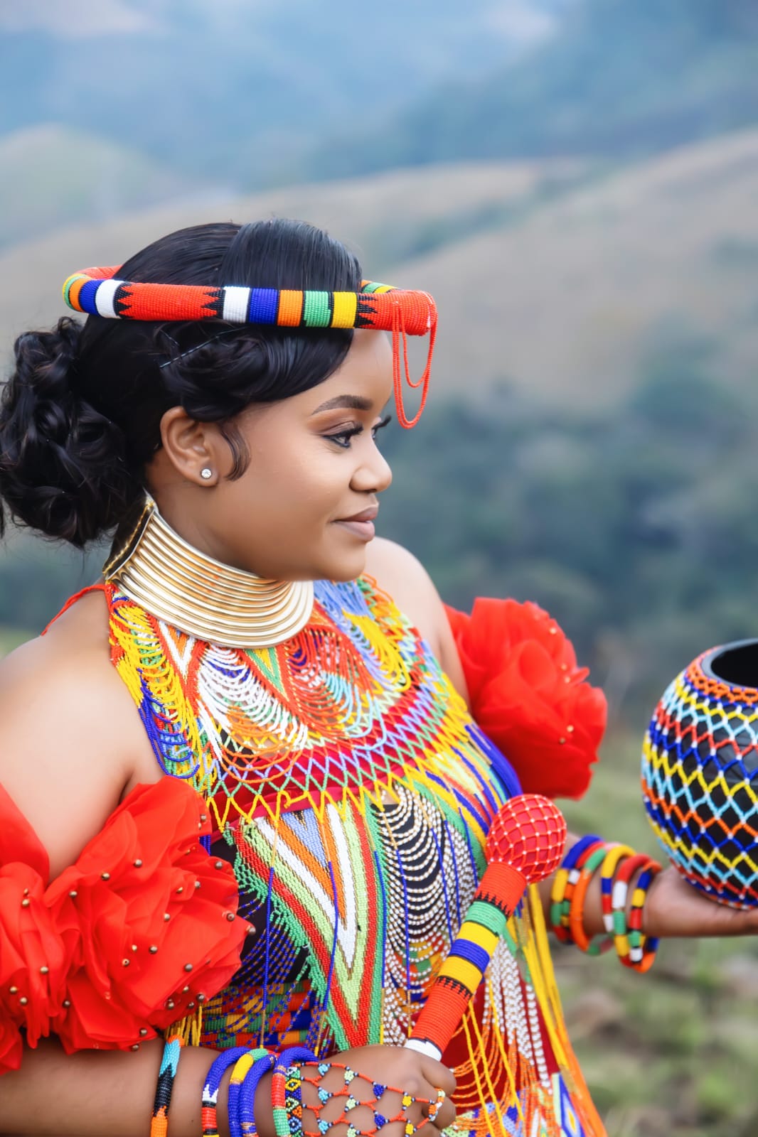 A close-up bridal portrait in rich traditional beadwork